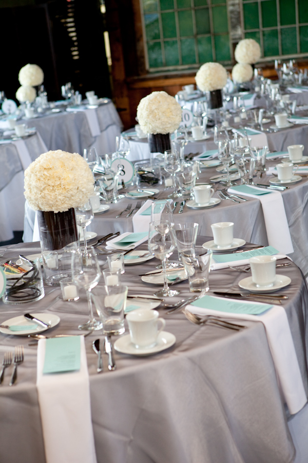 silver, white, light blue and ivory themed reception table tops - photo by Seattle based wedding photographers La Vie Photography